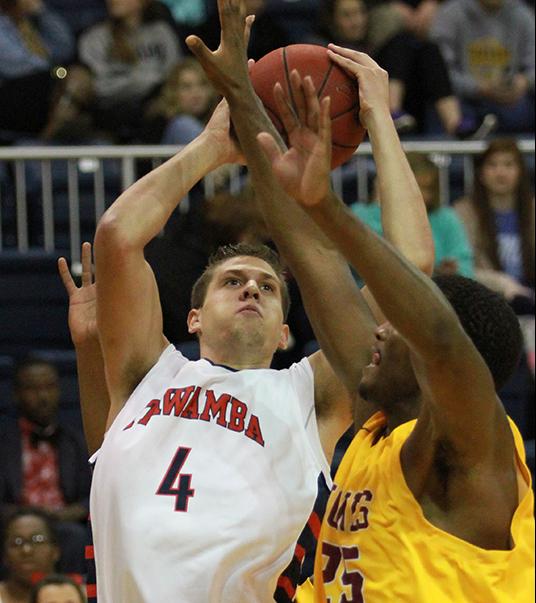 Cody North (4) puts up a shot over a Jones defender. (Lee Adams/ICCImages.com)