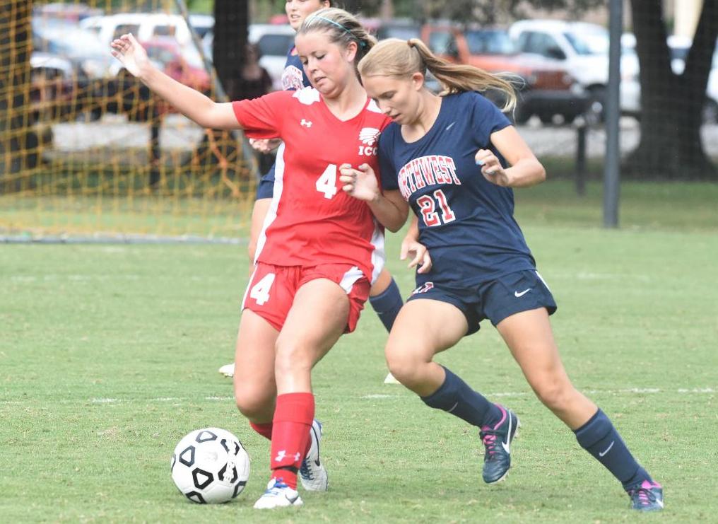 Alyssa Kelley (4) battles with a Northwest defender for possession. (Maggie Caldwell/ICCImages.com)